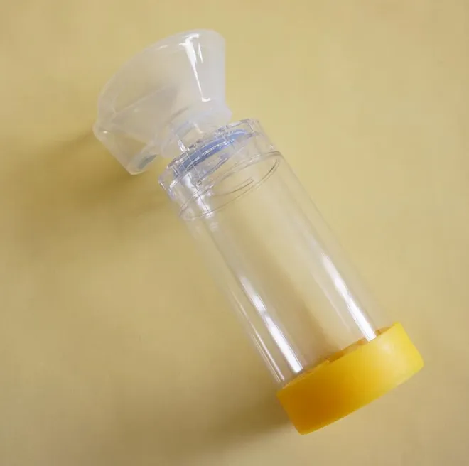 Disposable medical asthma spacer and aerosol holding chamber